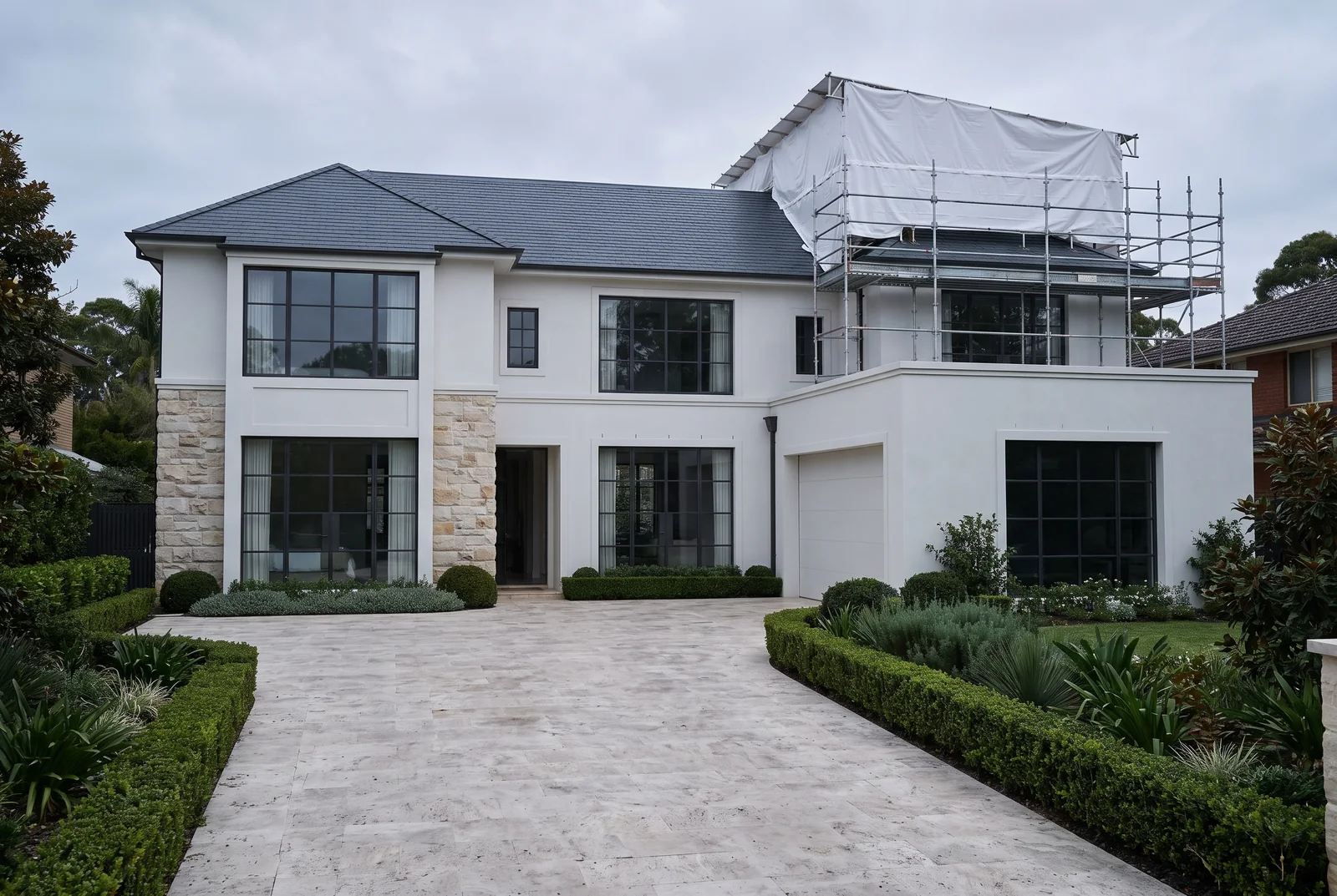 Large Sydney home during an upper-level addition, weather protection in place