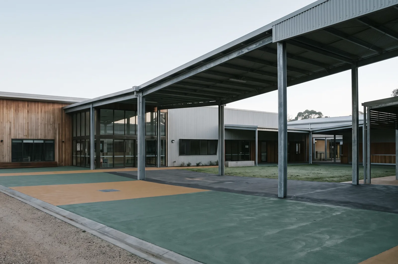 Covered walkway of a school building maintained by Vertex