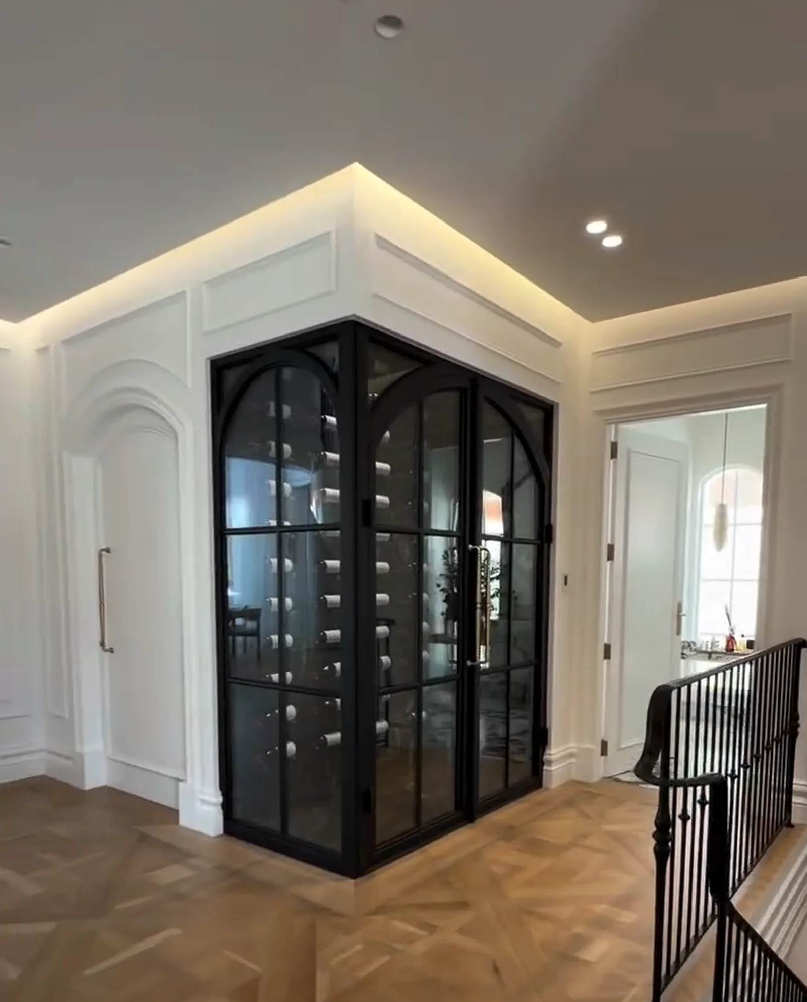 Glazed wine room set into the joinery off the entry hall